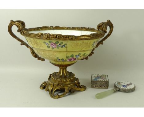 A French faience bowl, late 19th century, of ogee form painted and gilded with flowers against a yellow ground, with a foliat