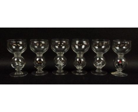 A set of six hand blown glasses, with knops containing hunting horses and riders, and hunting hounds, 12cm high. (6)