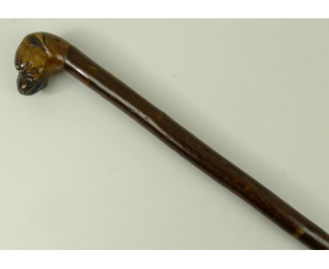 A walking stick, early 20th century, the knop carved as a Boxer dog, 91cm long.