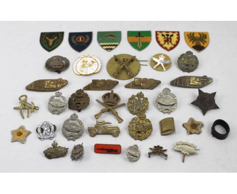 Militaria: a collection of replica and original military cap badges, together with South African enamel military shield badge