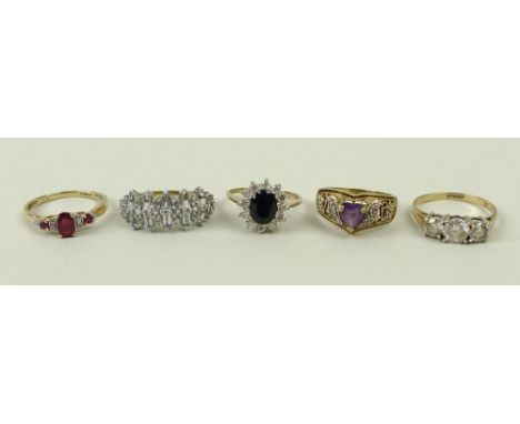 A 9ct gold and zircon three stone ring, size Q, 9ct gold and sapphire ring in a surround of zircons, size M, a 9ct gold and r