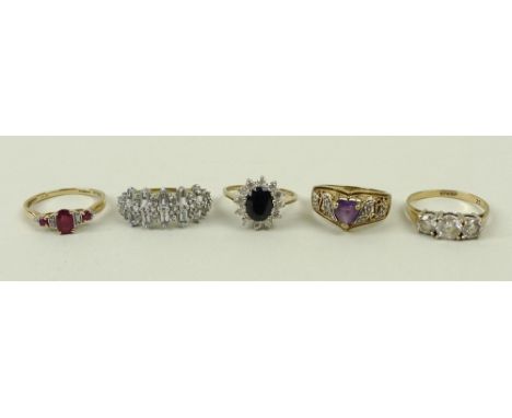 A 9ct gold and zircon three stone ring, size Q, 9ct gold and sapphire ring in a surround of zircons, size M, a 9ct gold and r