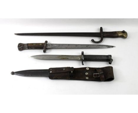 Militaria: a Swedish bayonet with steel scabbard and leather frog, a late 19th century St Etienne style French bayonet, with 