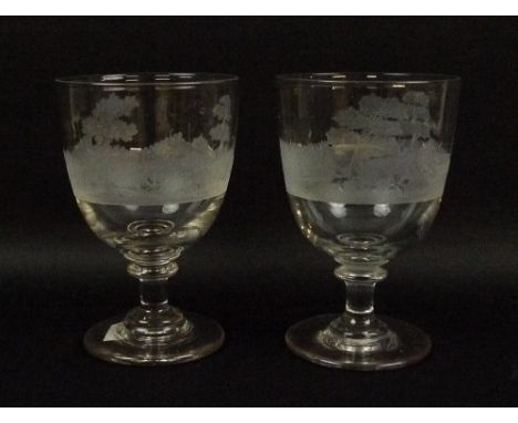 A pair of hand blown and engraved goblets, with ground pontils, the bowl wheel engraved with hunting scenes, 15cm. 