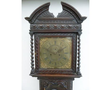 A late 18th century oak eight day long case clock, circa 1760, the brass face with cast brass spandrels, separate chapter rin