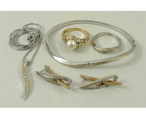 A white gold and diamond matching set consisting of ring, bangle and necklace, of slightly curved form, together with a pearl