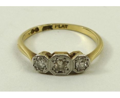 An 18ct gold, platinum and diamond three stone ring, illusion set, approximately 0.125ct, size K, 1.8g. 