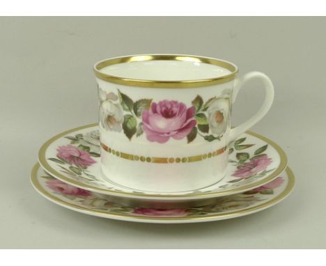 A Royal Worcester porcelain part tea service decorated in the 'Royal Garden' pattern, comprising cake plate, cream jug, sugar