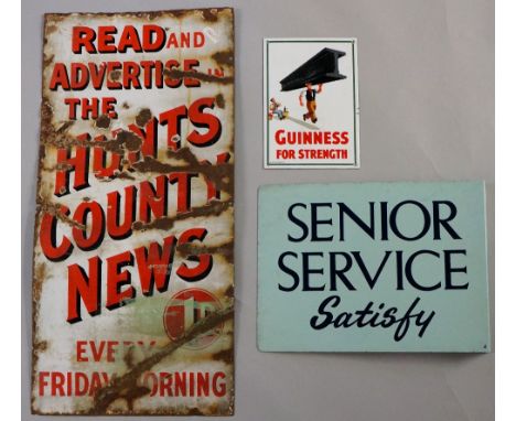A reproduction Guineess For Strength enamel sign, a Senior Service Satisfy enamel sign by NL Cowling, Charlton Ltd, and a Hun