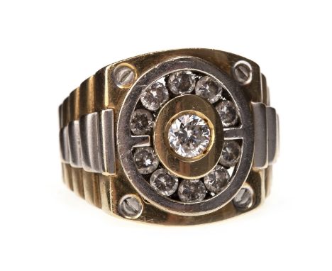 GENTLEMAN'S GEM SET RING, the rectangular bezel with an oval aperture with channel set round white gems, on ribbed bi colour 