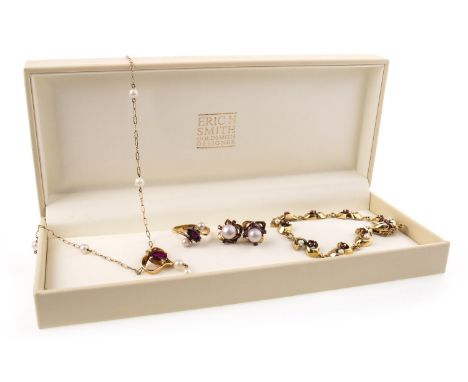 RUBY AND PEARL SUITE OF JEWELLERY, comprising a necklace set with an oval ruby 8mm long within an openwork heart, with two su
