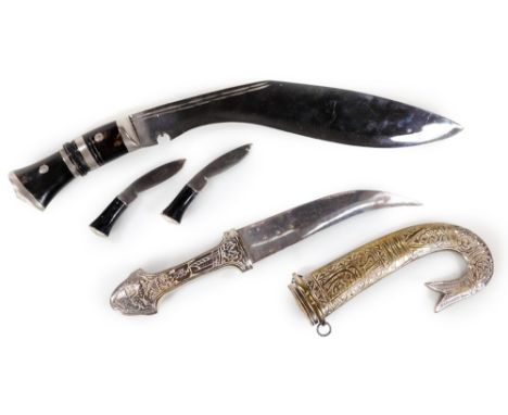 An early 20thC kukri with shaped blade and turned handle, 40cm W, and an Arabian khanjar dagger with curved blade and scabbar