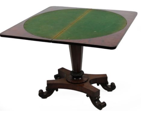 A 19thC mahogany fold over card table, with baize lined insert, scroll frieze, tapering stem and inverted platform base termi