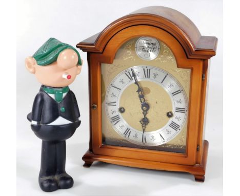 A 20thC Rapport mantel clock, in walnut case with 14cm W dial, with Roman numeric chapter ring and an Avon Cosmetics Daily Mi