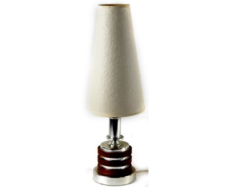 A 20thC retro chrome plated and wooden table lamp, with tapering shade on circular base, 66cm H.