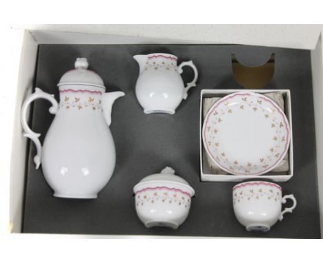 A 20thC Furstenberg West German porcelain service, comprising of a coffee pot, 21cm H, cream jug, lidded sugar bowl, single c