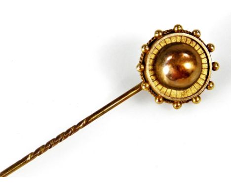 A Victorian stick pin, of circular form, with rope twist reeded borders, in fitted case.