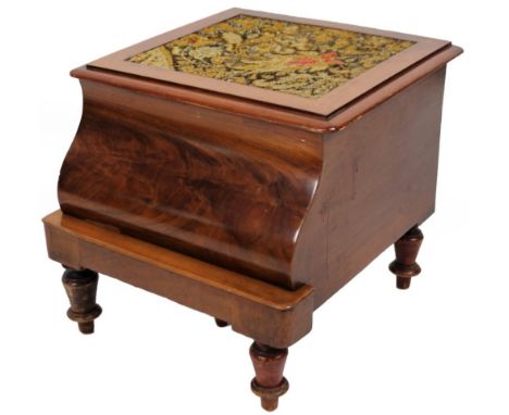 A Victorian mahogany box commode, with cushion front and overstuffed top with hinged lid and fitted interior, on turned legs,