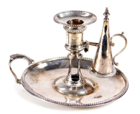 A George III silver chamber stick, with snuffer on circular base, having an acanthus capped handle, London, probably 1775, 12