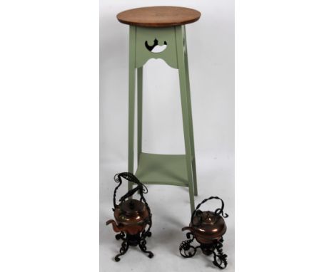 A 20thC painted oak jardiniere stand, the circular top raised on square tapering legs joined by an inverted shelf, 99cm H, 38