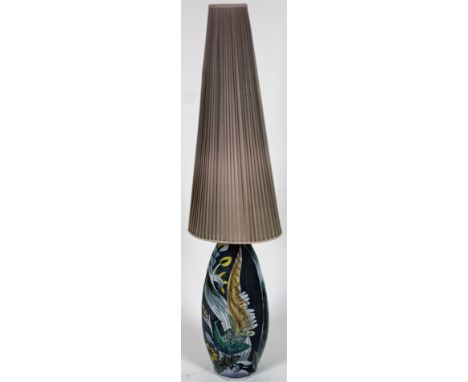 A Swedish Higman Kerami studio pottery lamp, decorated with birds and flower with material shade, the main body 63cm H.