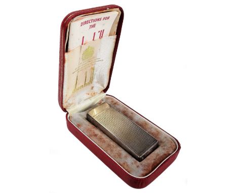 A mid 20thC Dunhill pocket lighter, of rectangular form partially engine turned, 6.5cm H, in fitted box with paperwork and ou
