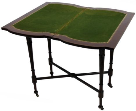 An Edwardian mahogany card table, the shaped twist top with baize lined partially tooled interior, revealing a deep well, on 