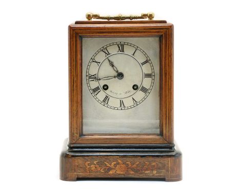 A late 19th century French carriage clock, in a marquetry case, with drum movement striking on a bell, the front glass slidin