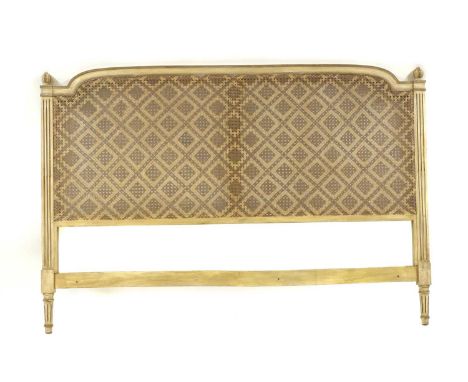 A French Louis XVI-style painted and caned headboard, 20th century, with fluted posts, 171cm wide, 116cm high, together with 