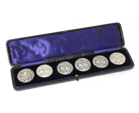 A cased set of six Art Nouveau silver buttons, by Levi &amp; Salaman, Birmingham 1905, each depicting a profile within a sinu