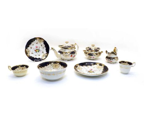 A 19th century Rockingham style porcelain tea set, with hand painted floral spray centres, with a blue Royal border, comprisi