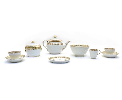 A Regency New Hall porcelain teaset, comprising of teapot, sugar bowl, slop bowl, cake plate, cups and saucers, all having gi