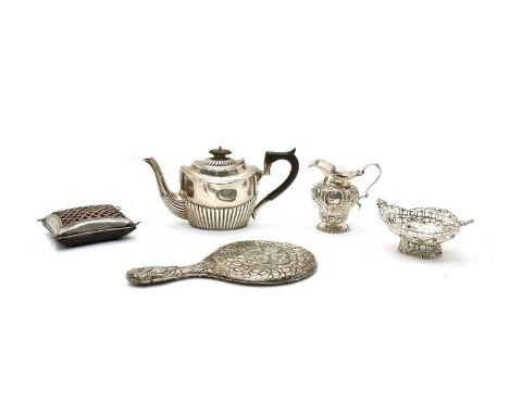 Five early 20th century silver items: oval teapot, milk jug by Charles Clement Pilling, unusual pin cushion, by WC, London 19