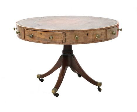 A George IV mahogany drum table, with inset tooled leather (fragmented), four fitted drawers, fitted Bramah locks, on a simpl