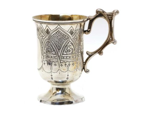 A Victorian silver gothic revival cup, Hilliard &amp; Thomason, Birmingham 1866, the body engraved with pointed arches and st