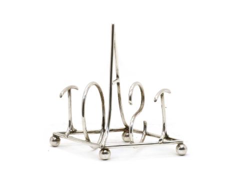 A novelty silver toast rack, Goldsmiths &amp; Silversmiths Co. Ltd, London 1901, the five bars formed as letters spelling 'TO