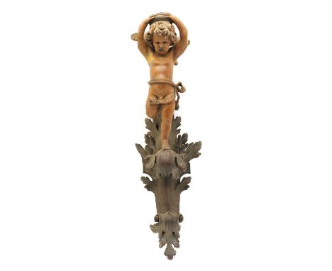 A carved softwood wall light, in the form of a cherub on a foliate mount, 53cm high and a mirrored glass wall light, early 20