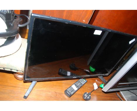 A Polaroid 27" flat screen TV with remote.