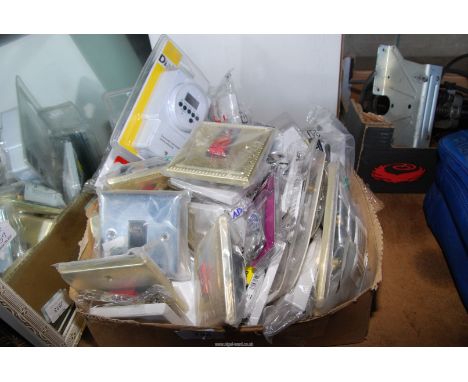 A quantity of electrical wall and light switches, a timer, etc.