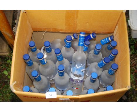 A large quantity of "Grey Goose" vodka bottle.