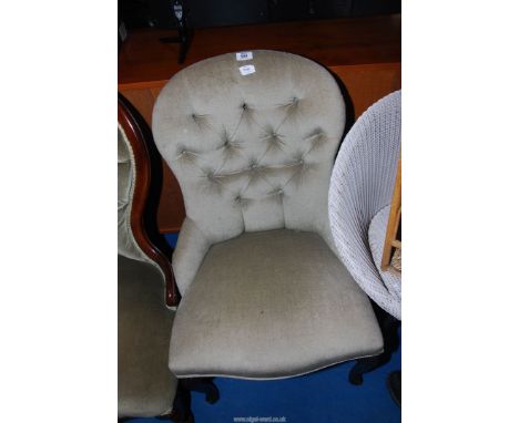 A button back nursing chair.