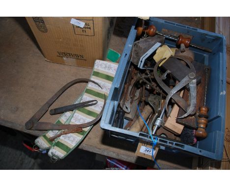 A box of vintage hand tools to include: screwdrivers, gauges, levels, etc.