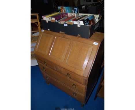 A light oak bureau, 38" wide x 38" high x 16 1/2" deep.