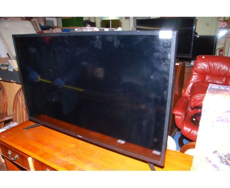 A Samsung 42" flat screen TV, with remote control, power cable and instruction manual.