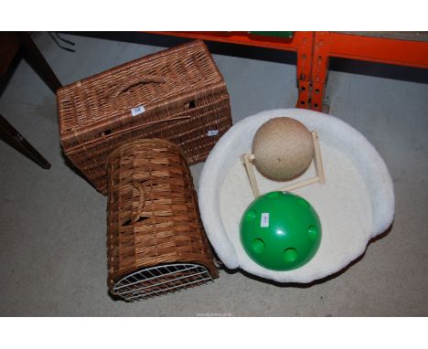 A cat basket, bed, a scratch roller and mouse pop-out toy, together with a picnic hamper.
