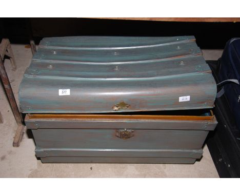 A metal trunk (as found) 27" x 19" x 18".