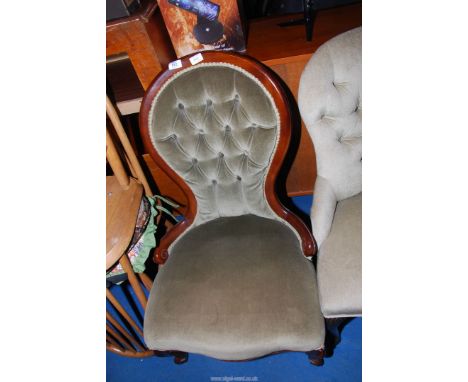 A button back low nursing chair.