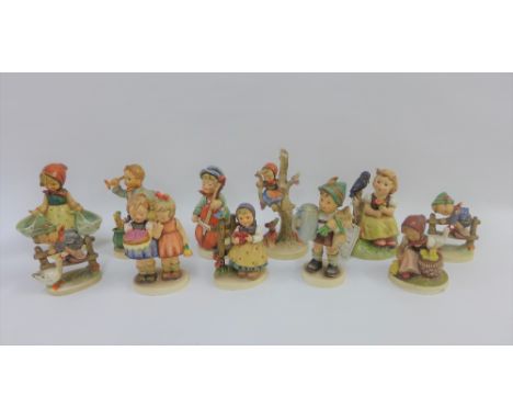 Collection of eleven Goebel and Hummel figures to include 'Happy Birthday' etc, tallest 16cm (11)