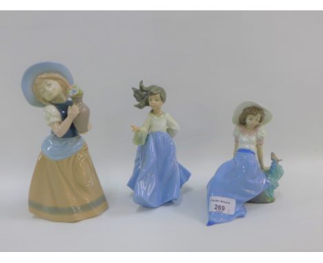 Two Nao porcelain figurines and a Nadal figure, tallest 22cm (3) 