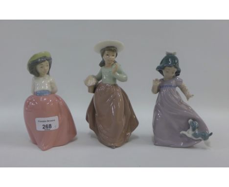 Three Nao porcelain figurines, tallest 18cm (3) 